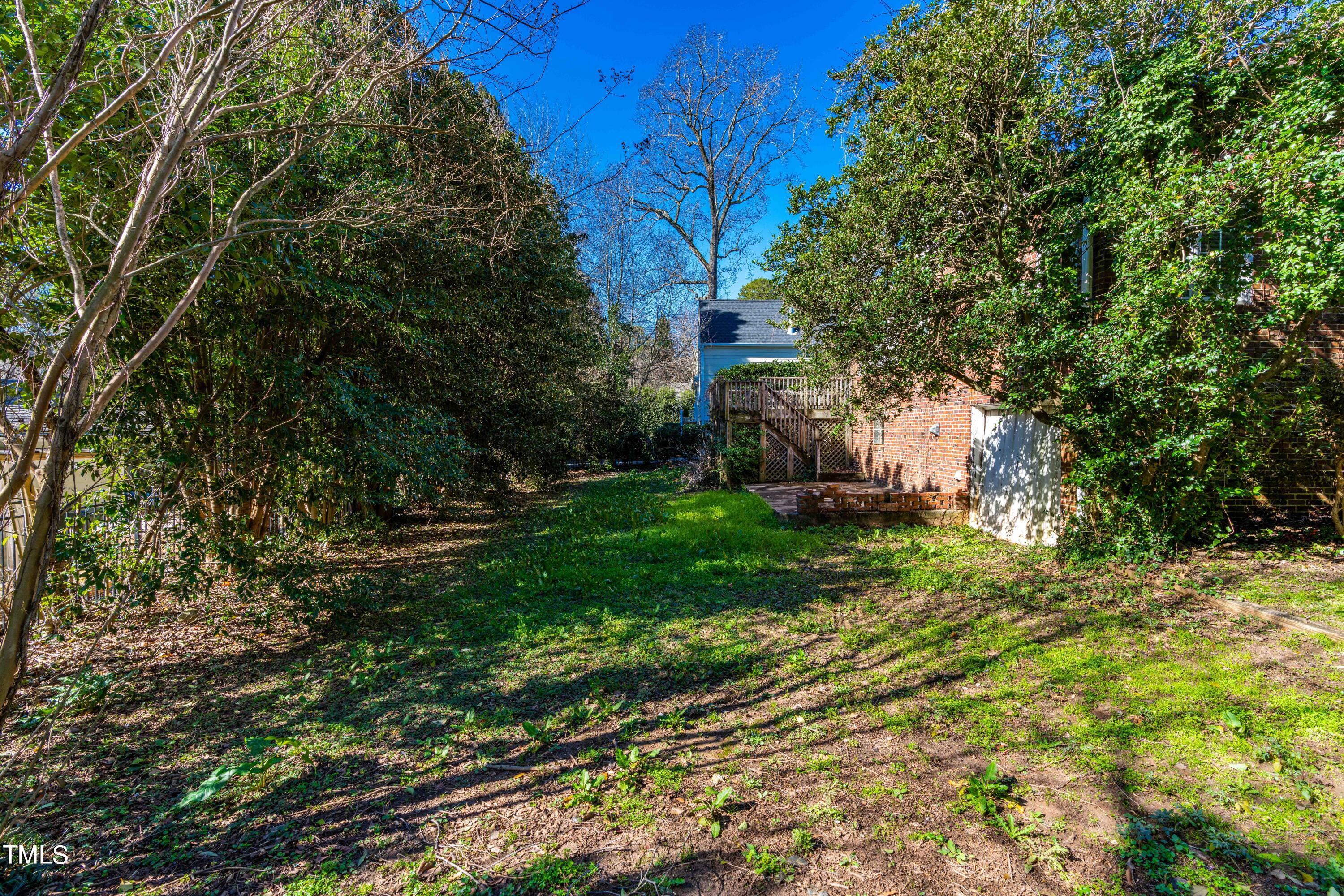 903 Lake Boone Trail Raleigh, NC 27607 - Photo 22 of 25 a backyard of a house with lots of green space