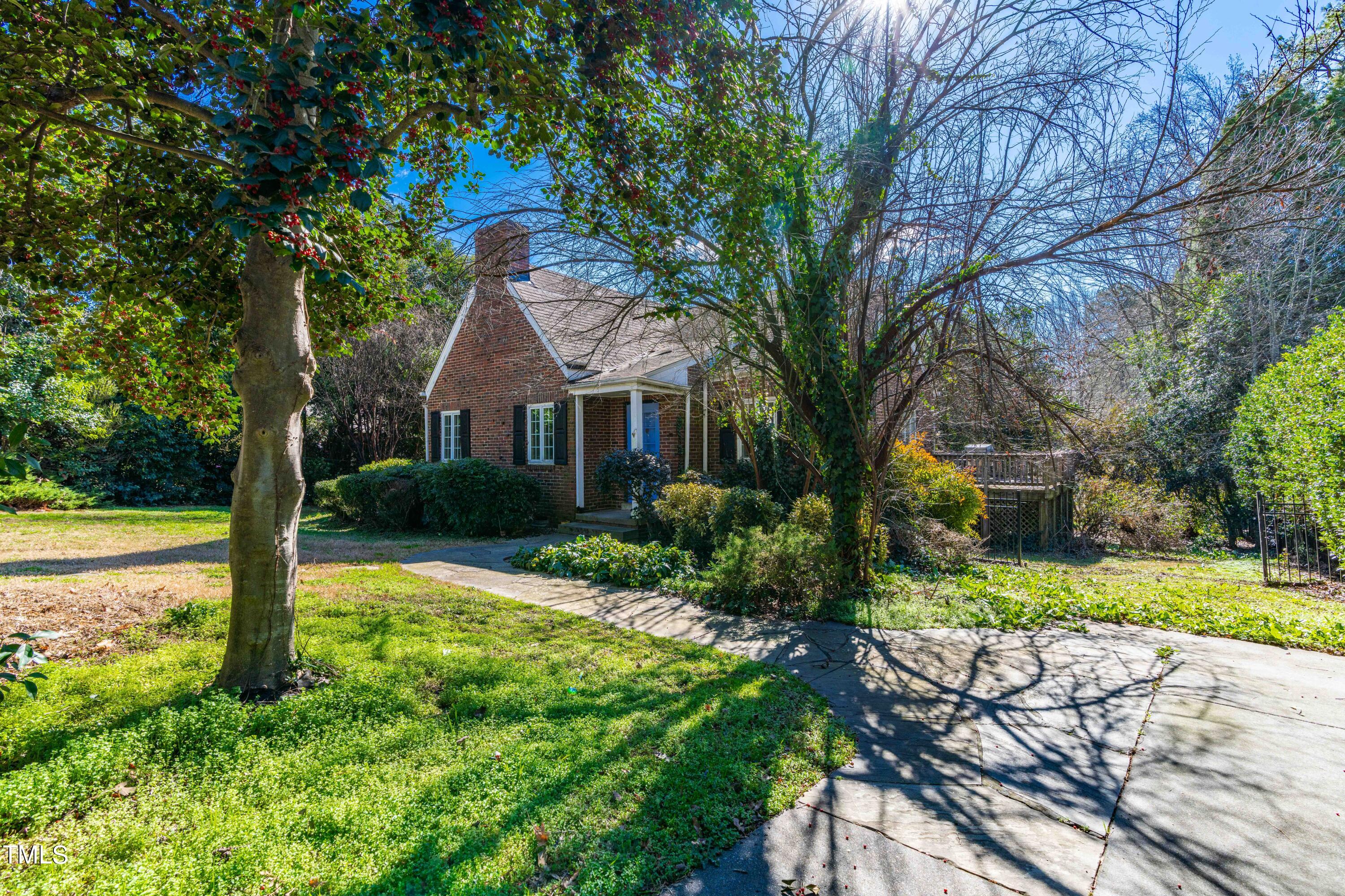 903 Lake Boone Trail Raleigh, NC 27607 - Photo 3 of 25 a front view of a house with garden