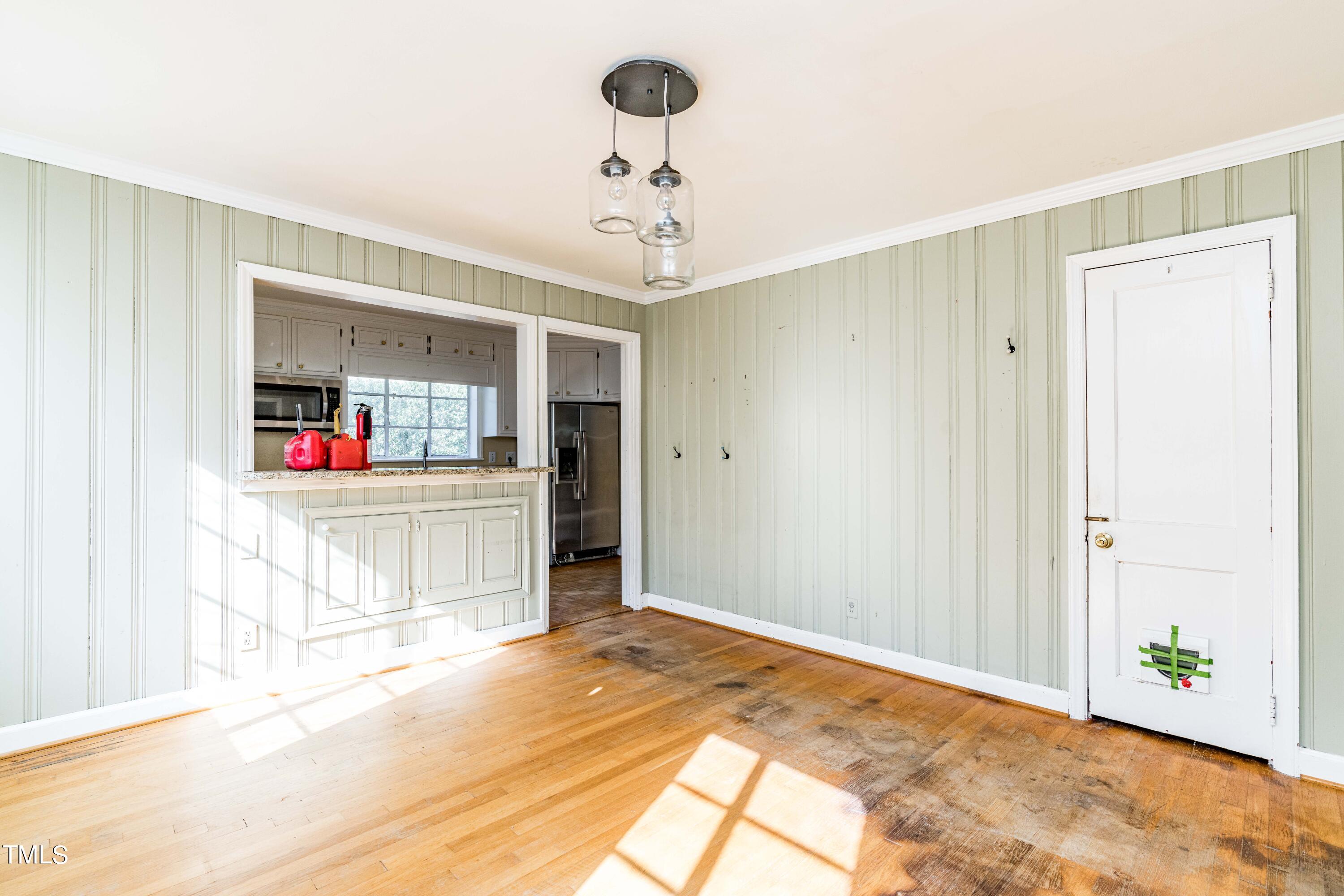 903 Lake Boone Trail Raleigh, NC 27607 - Photo 10 of 25 a bedroom with a bed and a chandelier