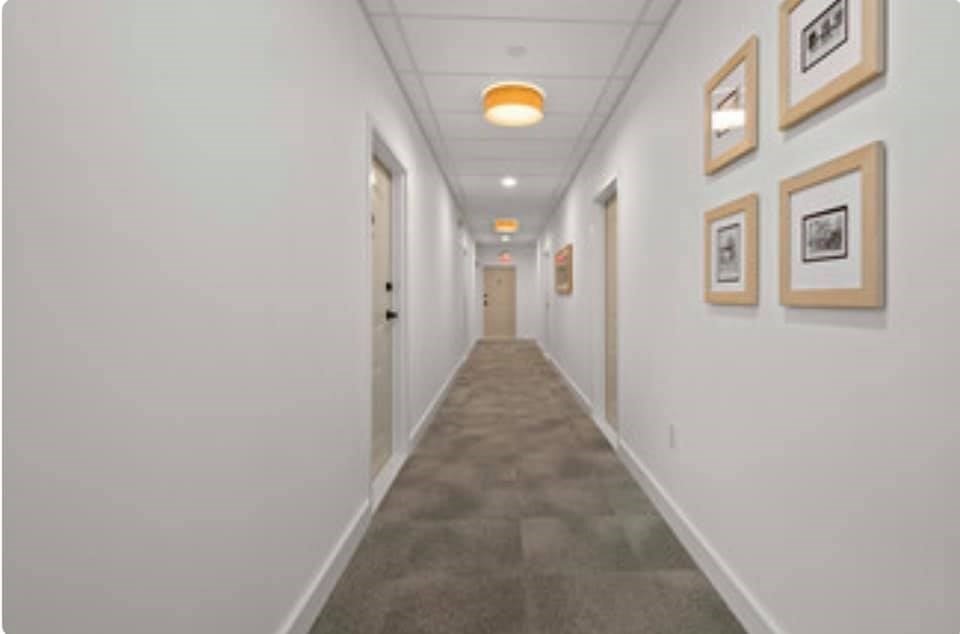 301 North, Unit 7 Wakefield, MA 01880 - Photo 3 of 15 a view of a hallway with wooden floor