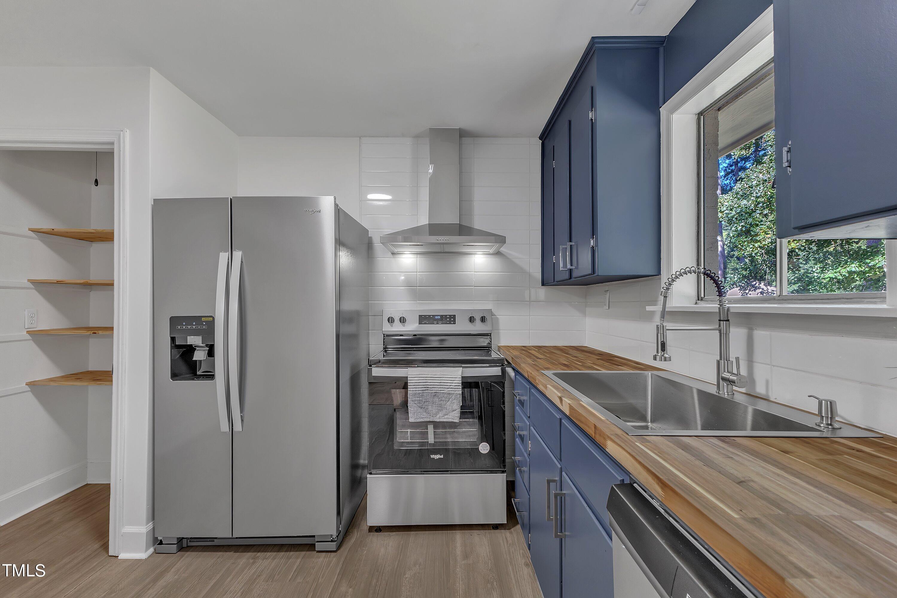 3317 Scott Drive Raleigh, NC 27604 - Photo 11 of 29 a kitchen with stainless steel appliances granite countertop a refrigerator and a sink