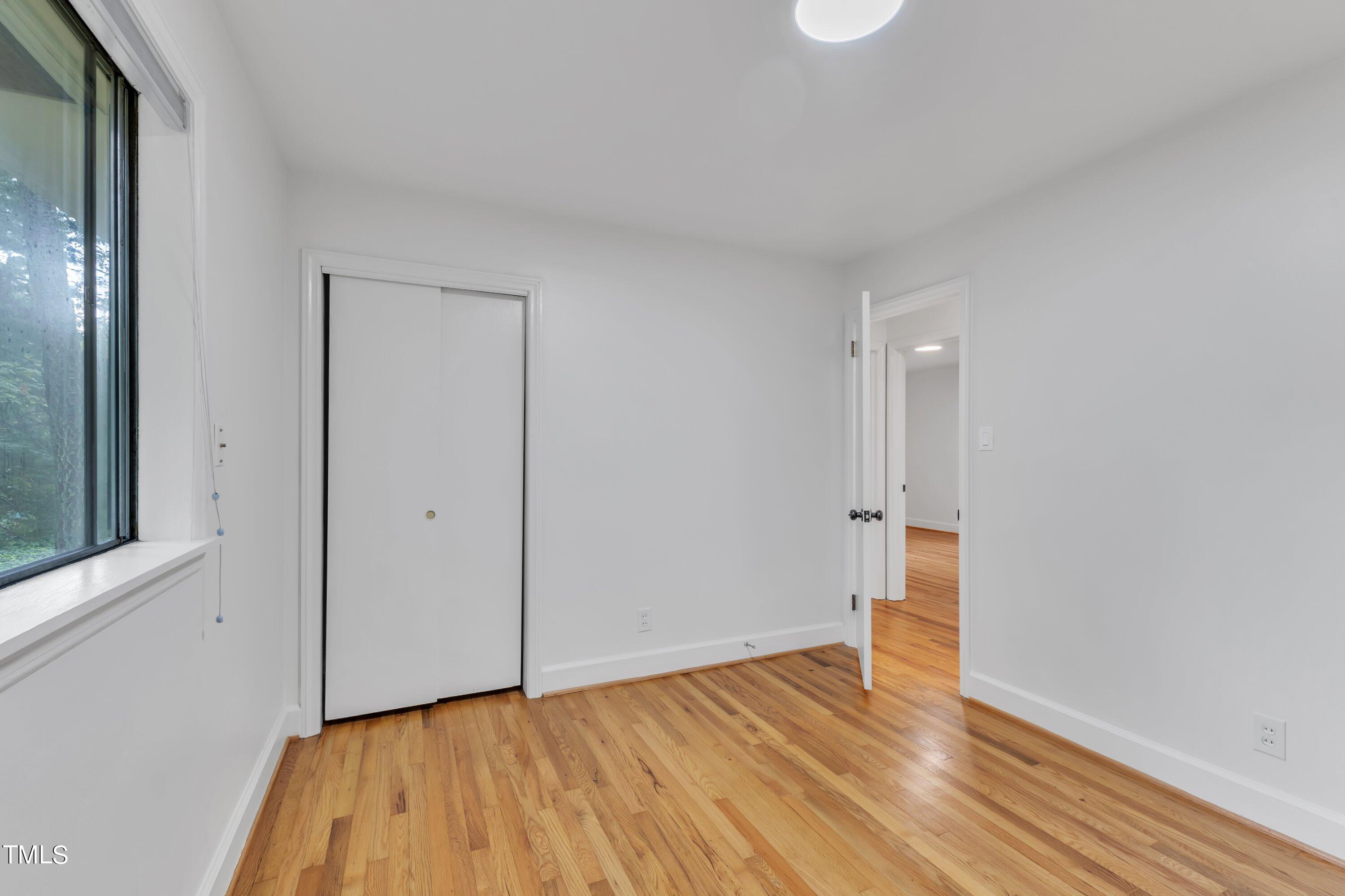 3317 Scott Drive Raleigh, NC 27604 - Photo 15 of 29 a view of an empty room and wooden floor