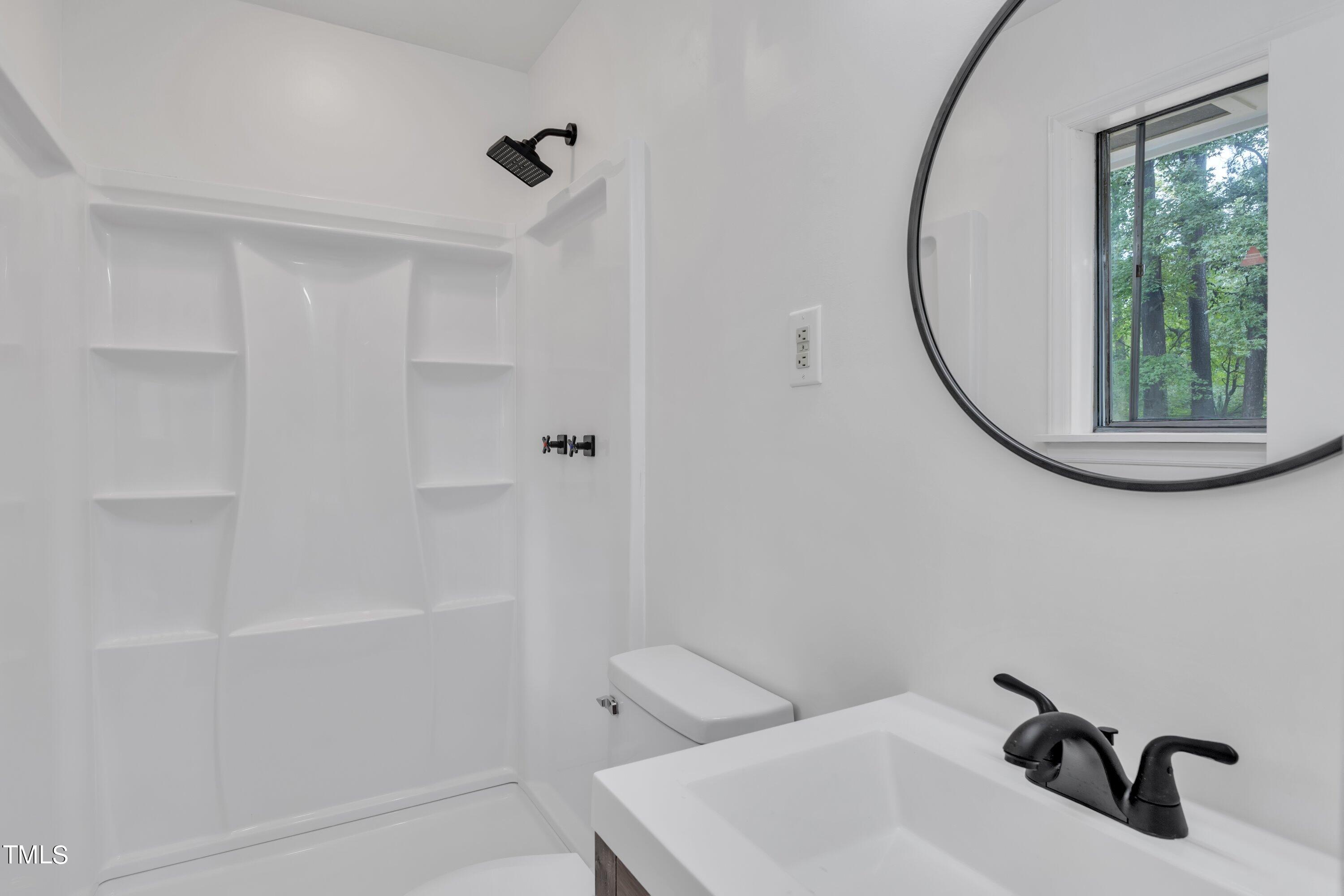 3317 Scott Drive Raleigh, NC 27604 - Photo 22 of 29 a bathroom with a sink and a mirror