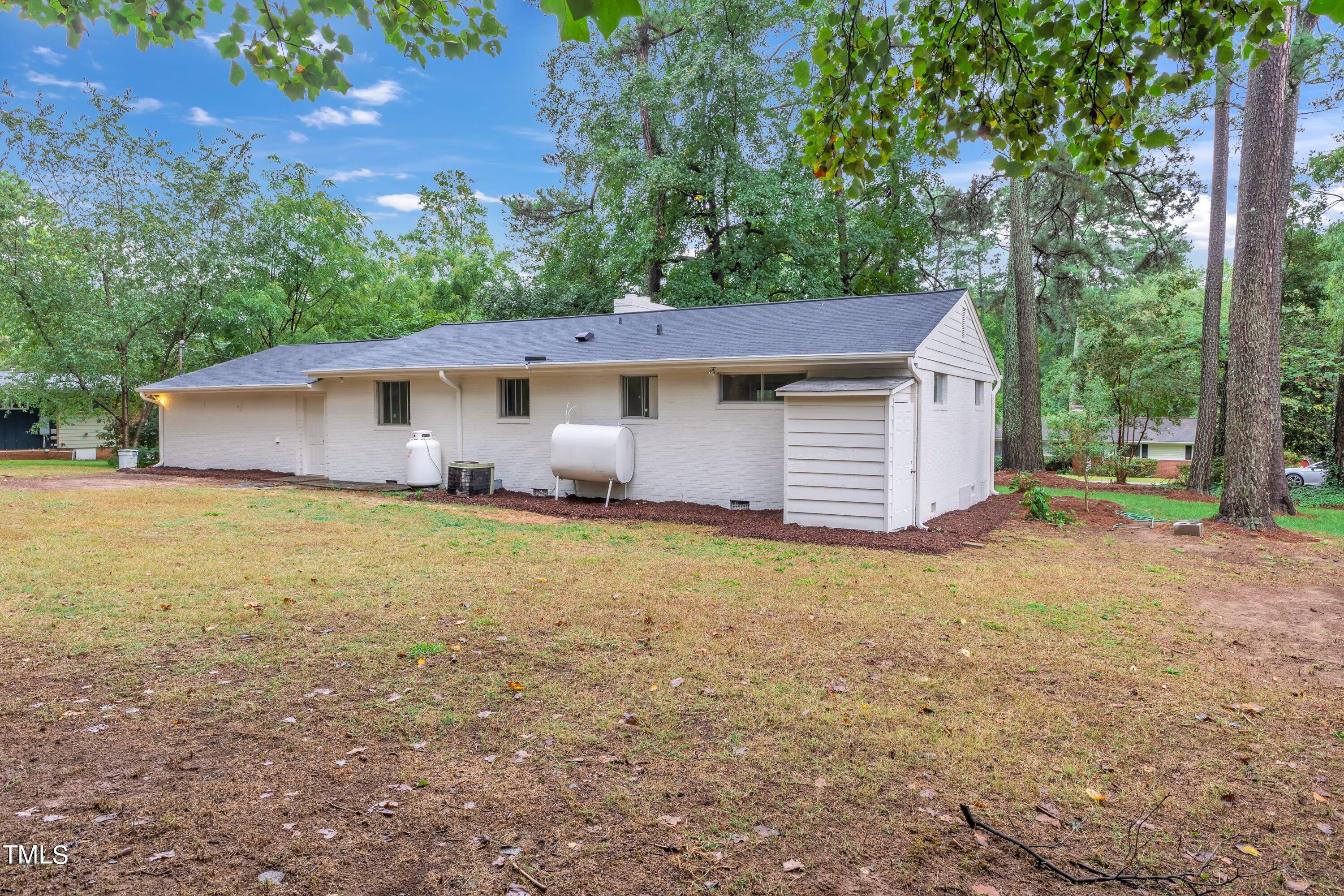 3317 Scott Drive Raleigh, NC 27604 - Photo 28 of 29 a front view of house with yard and trees in the background
