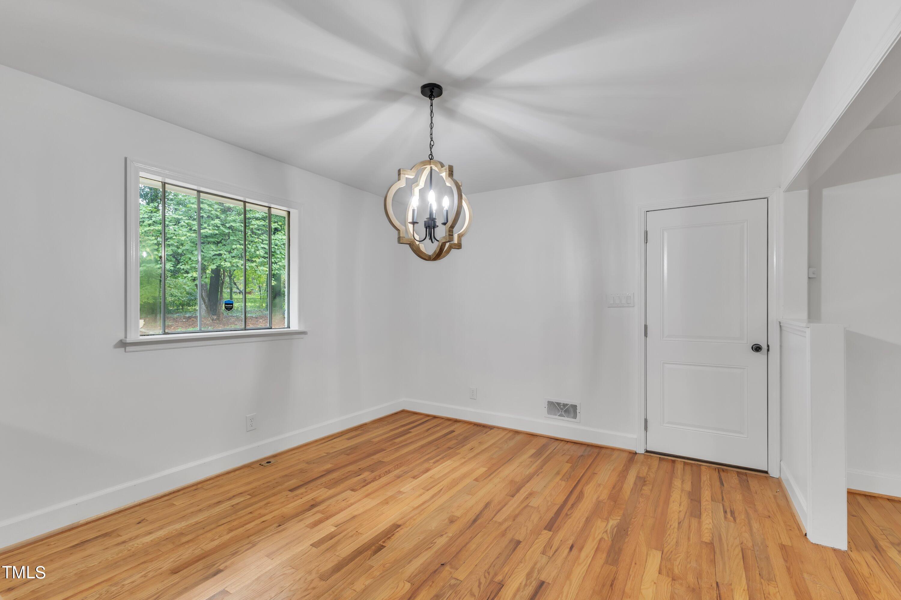 3317 Scott Drive Raleigh, NC 27604 - Photo 7 of 29 a view of a room with wooden floor and window