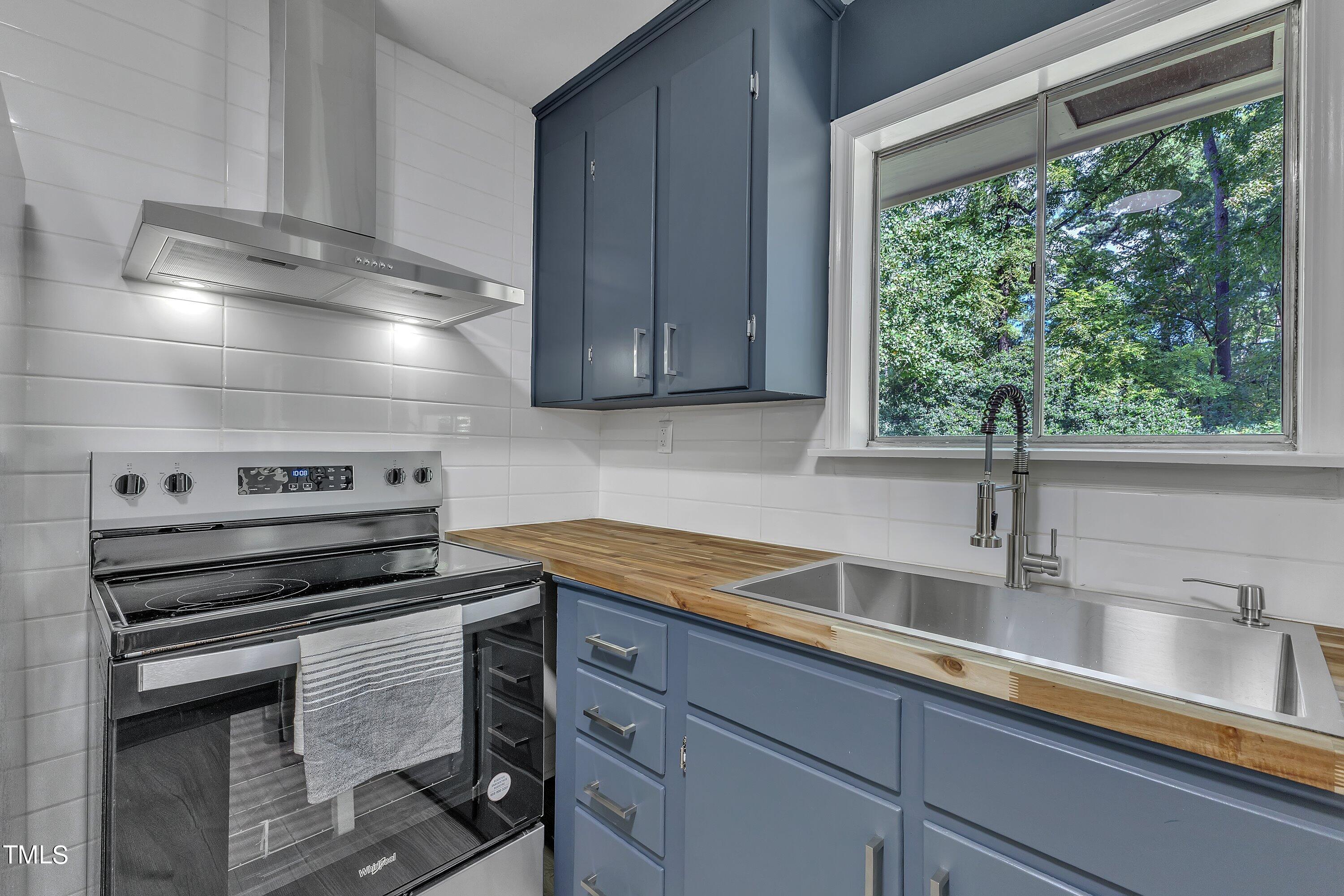 3317 Scott Drive Raleigh, NC 27604 - Photo 10 of 29 a kitchen with a sink and a window
