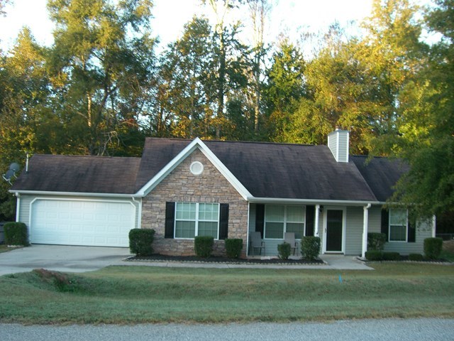 251 Autumn Ridge Trail Gray, GA 31032 - Photo 6 of 16 a front view of a house with a yard