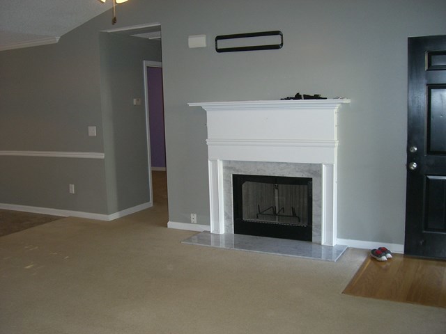 251 Autumn Ridge Trail Gray, GA 31032 - Photo 7 of 16 a living room with a fireplace