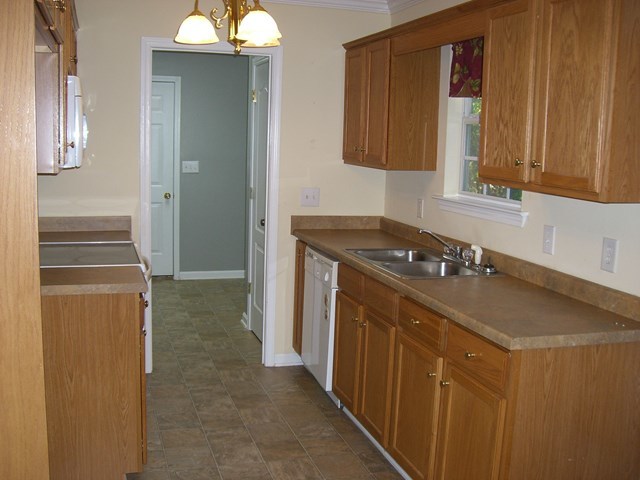 251 Autumn Ridge Trail Gray, GA 31032 - Photo 8 of 16 a kitchen with a sink and cabinets