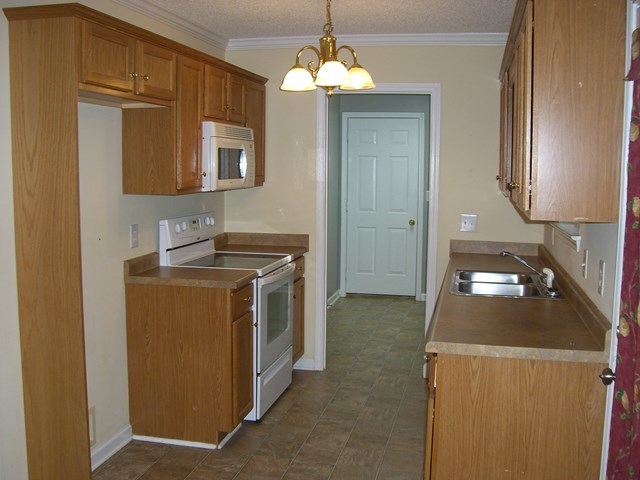 251 Autumn Ridge Trail Gray, GA 31032 - Photo 9 of 16 a kitchen that has a sink and a stove