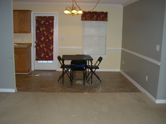 251 Autumn Ridge Trail Gray, GA 31032 - Photo 10 of 16 a view of a dining room with furniture and chandelier