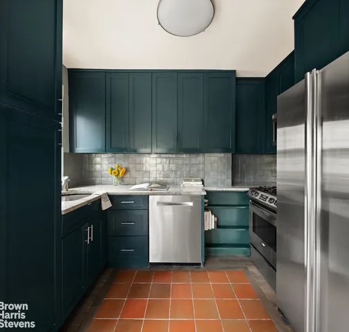 a living room with furniture a rug and a large window