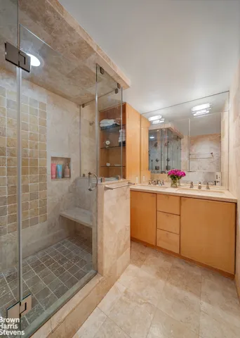 a bedroom with a bed couch and window