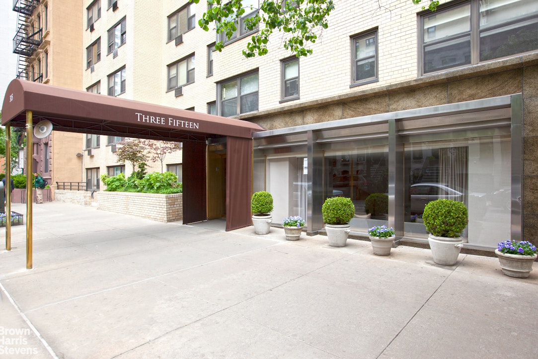 315 East 69th Street, Unit 5G Manhattan, NY 10021 - Photo 8 of 9 a view of a building with sitting area and porch