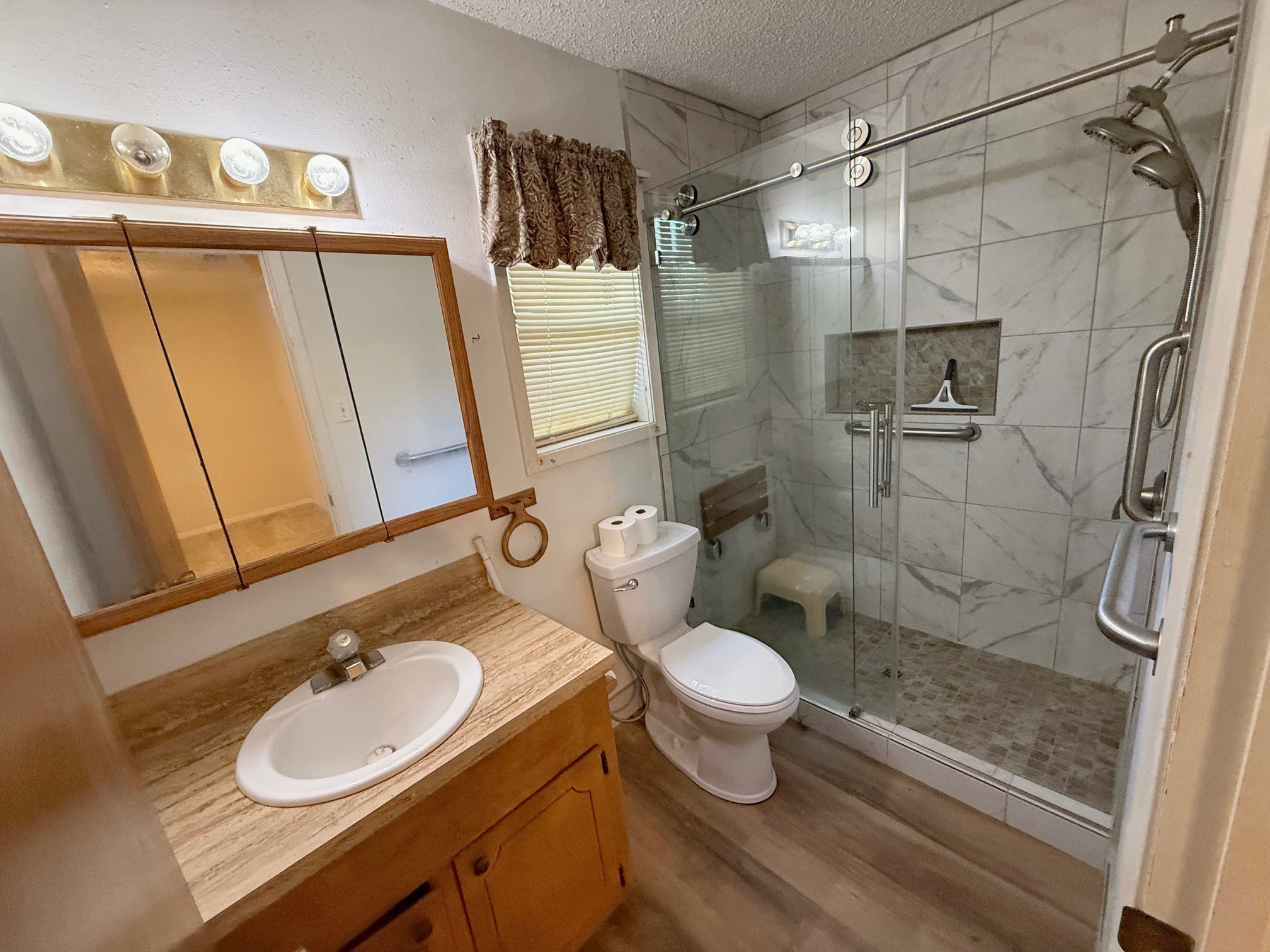 129 Stewart Street Centerville, TX 75833 - Photo 16 of 21 a bathroom with a sink toilet and shower