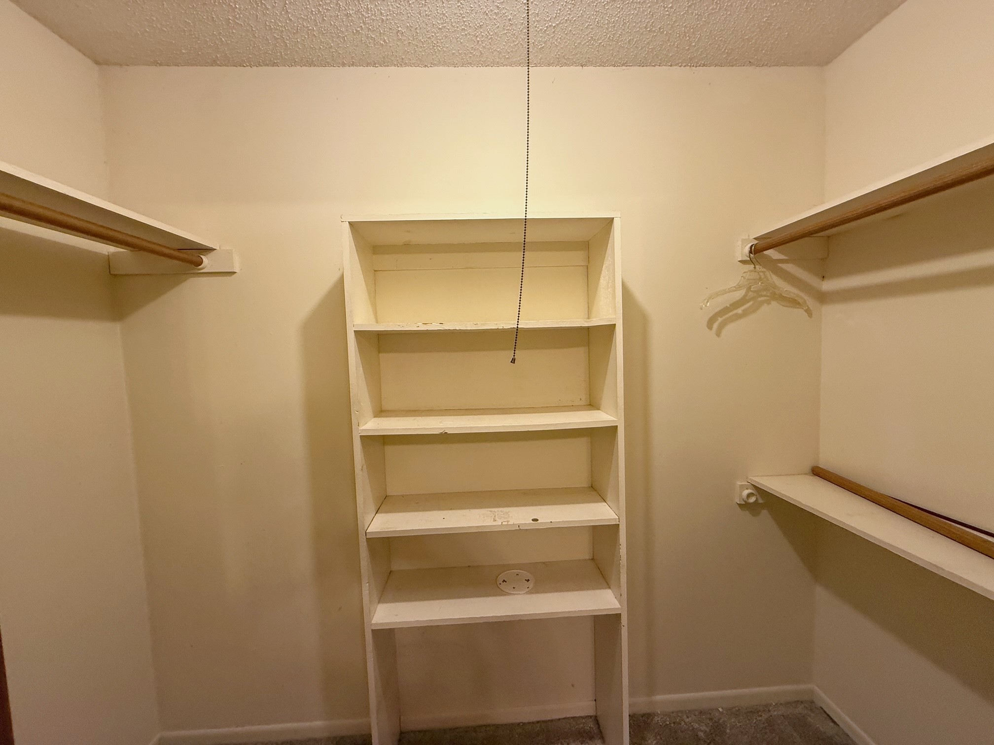 129 Stewart Street Centerville, TX 75833 - Photo 18 of 21 a view of walk in closet with empty racks