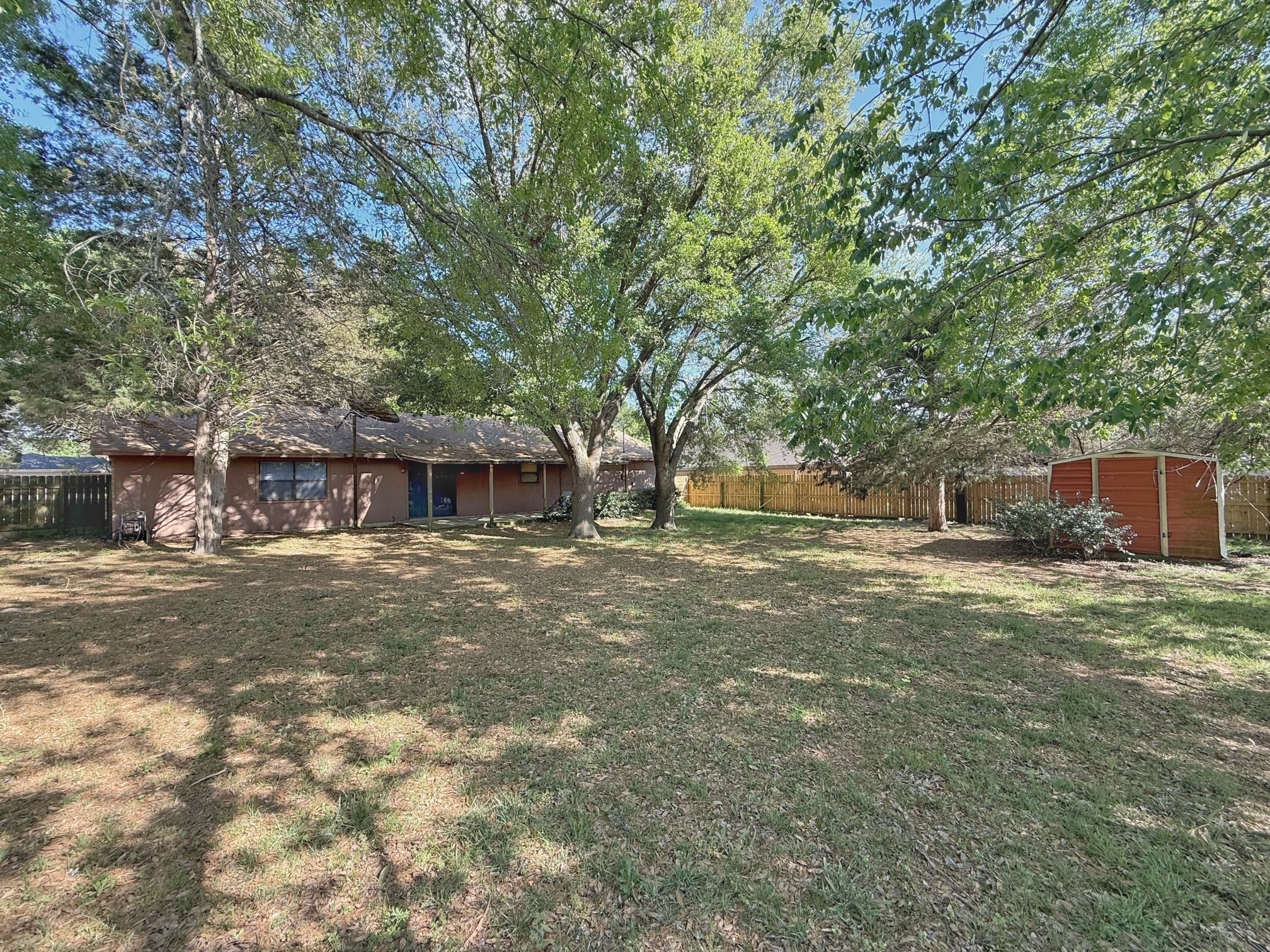 129 Stewart Street Centerville, TX 75833 - Photo 6 of 21 a front view of a house with a yard