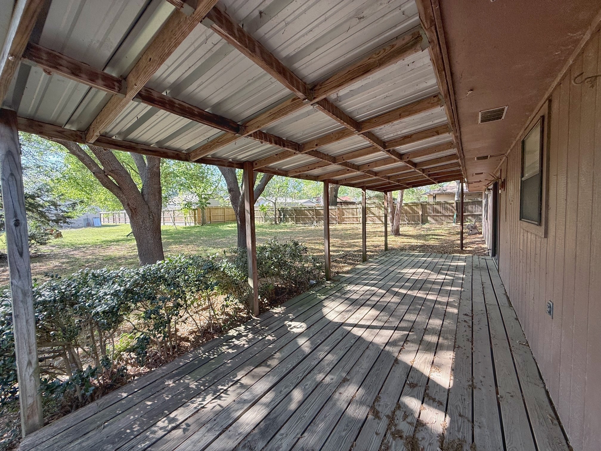 129 Stewart Street Centerville, TX 75833 - Photo 7 of 21 a view of a porch with wooden floor