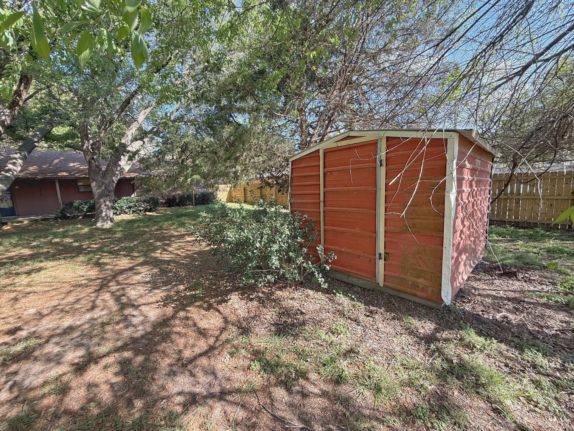 129 Stewart Street Centerville, TX 75833 - Photo 8 of 21 a view of a backyard with tree