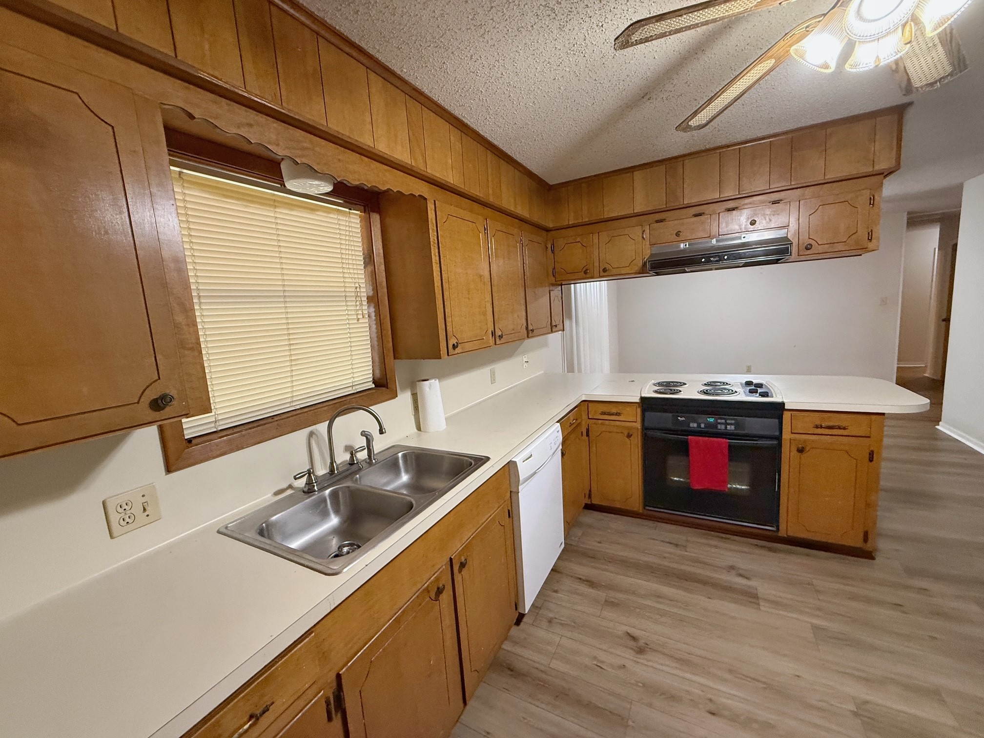 129 Stewart Street Centerville, TX 75833 - Photo 9 of 21 a kitchen with stainless steel appliances a sink and a stove