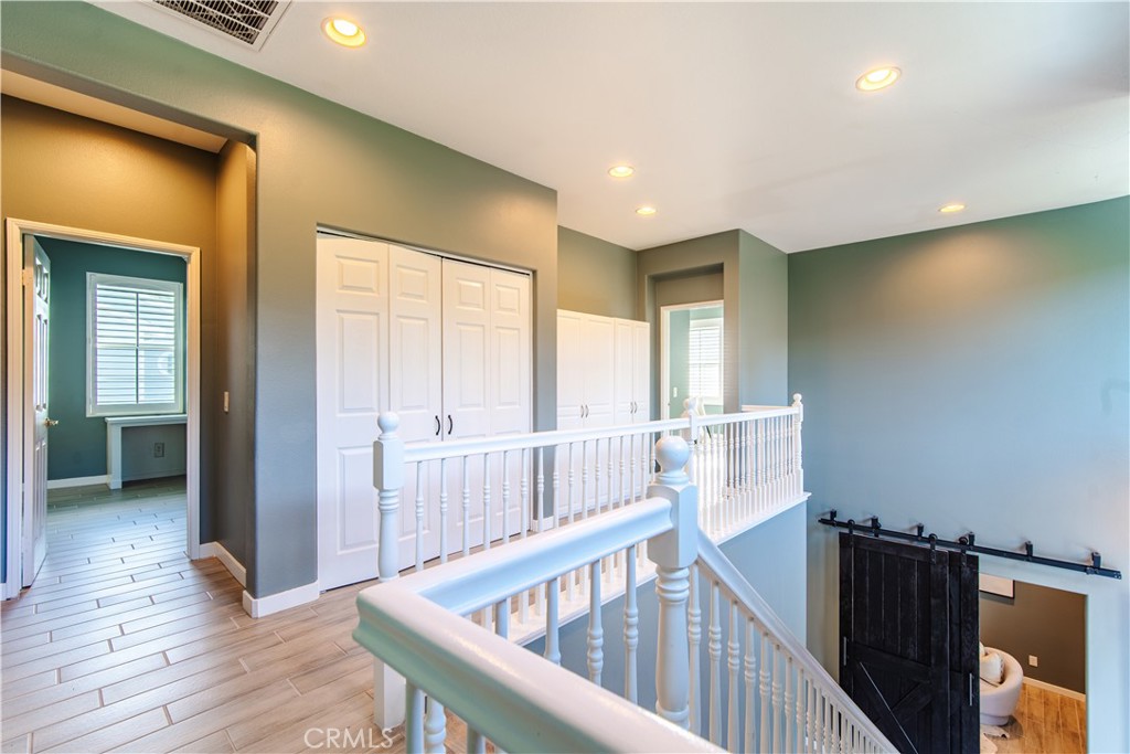 21 Thorp Ladera Ranch, CA 92694 - Photo 19 of 43 a view of a hallway with wooden floor and windows
