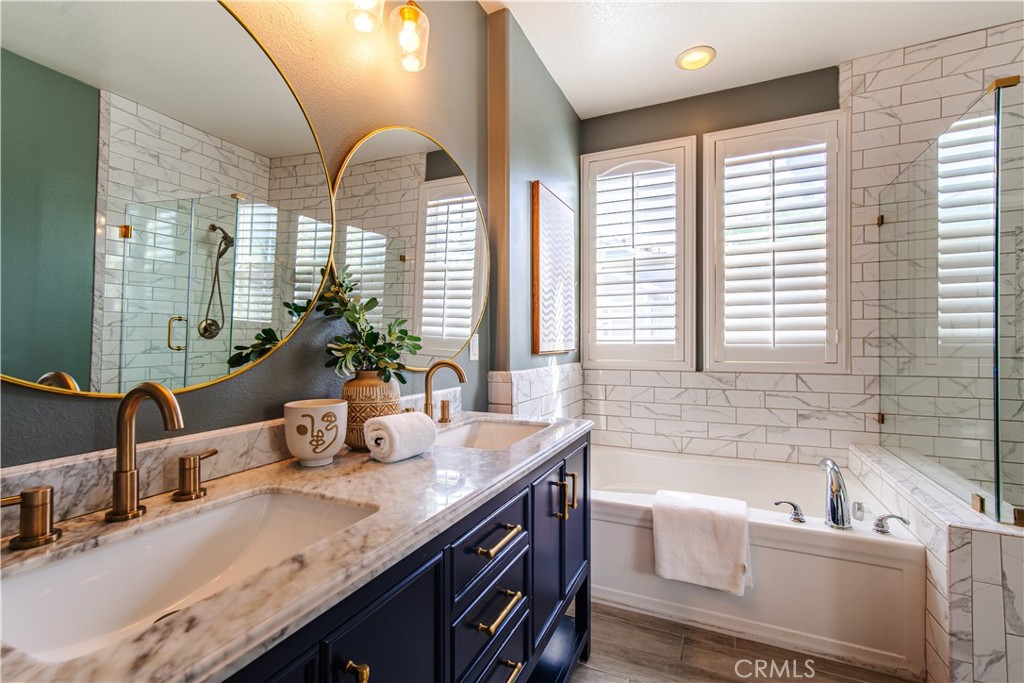 21 Thorp Ladera Ranch, CA 92694 - Photo 29 of 43 a bathroom with a granite countertop sink and a large mirror