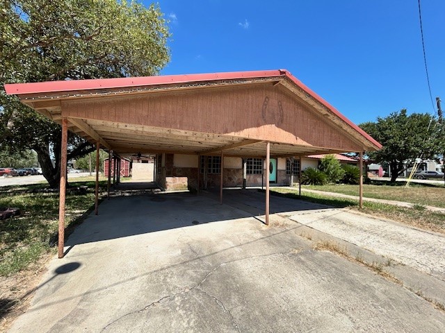 1200 Santa Rosa Street San Diego, TX 78384 - Photo 13 of 16 a view of patio with a table and chairs under an umbrella