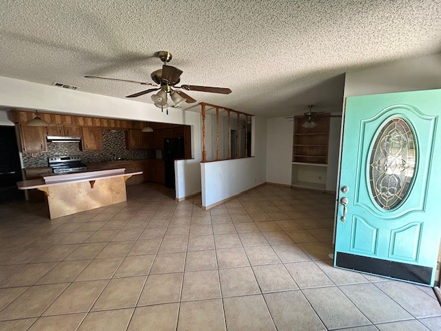 1200 Santa Rosa Street San Diego, TX 78384 - Photo 14 of 16 a kitchen with stainless steel appliances granite countertop a sink and a stove