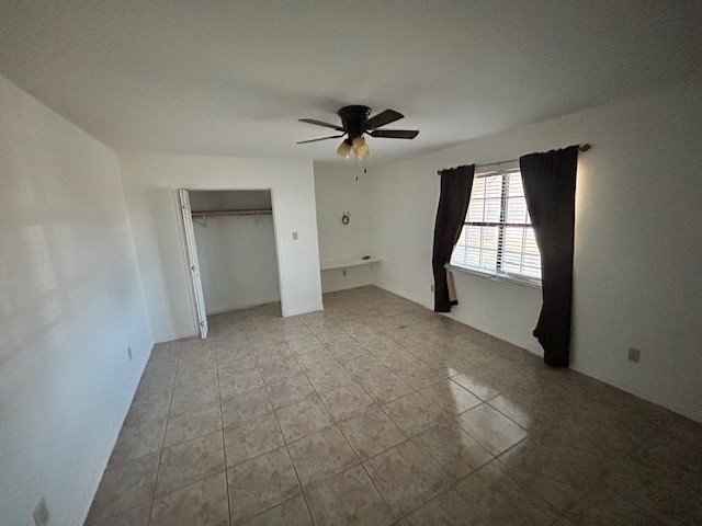 1200 Santa Rosa Street San Diego, TX 78384 - Photo 7 of 16 an empty room with windows and fan