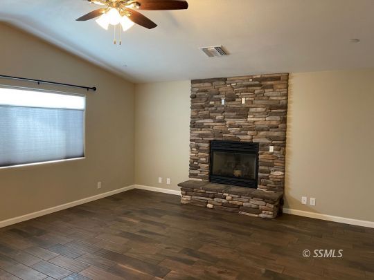 1104 South Yorktown Street Ridgecrest, CA 93555 - Photo 2 of 15 a living room with a fireplace