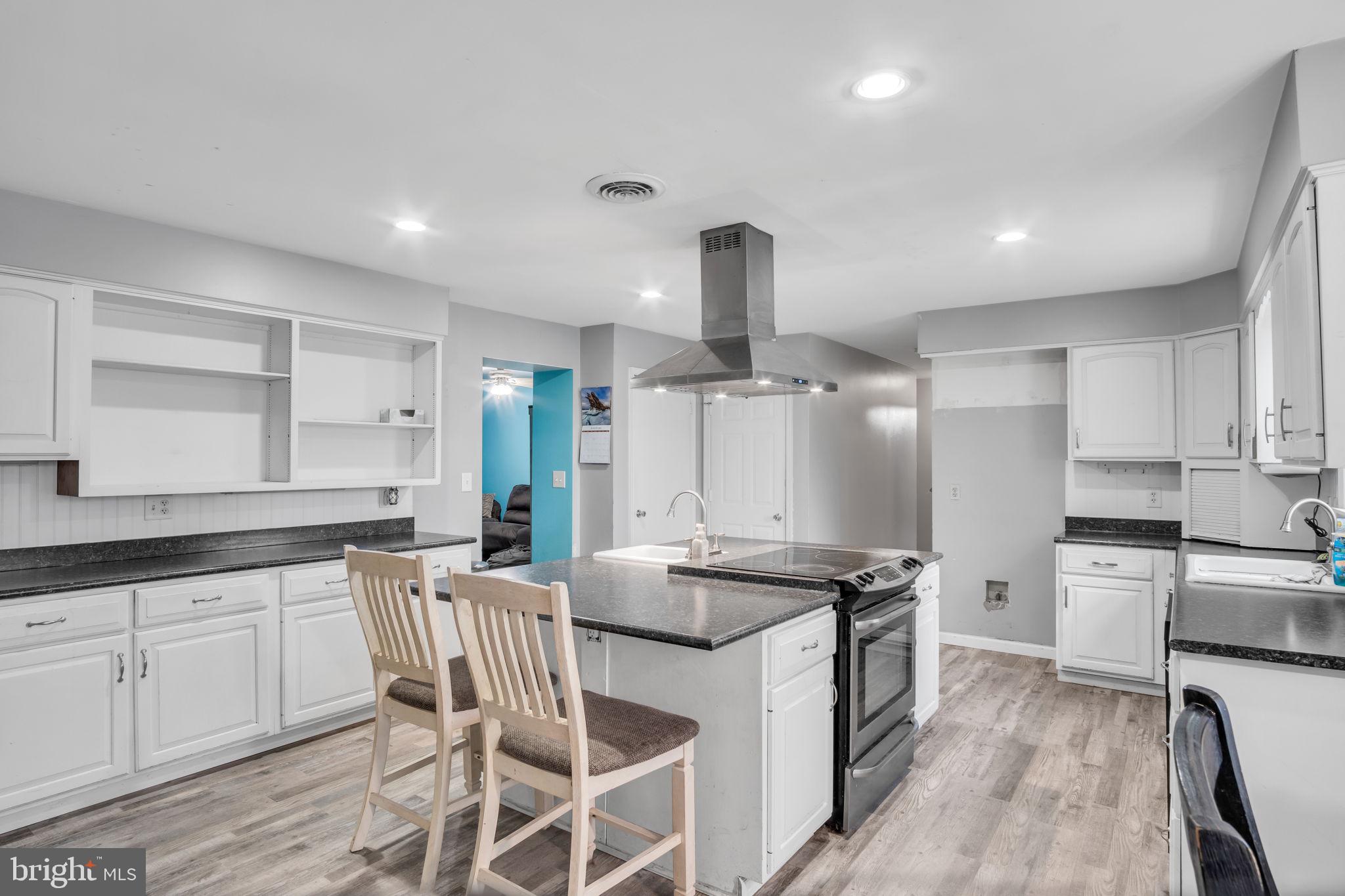 16 Hill Road Carlisle, PA 17015 - Photo 13 of 36 a kitchen with stainless steel appliances granite countertop a sink stove and refrigerator