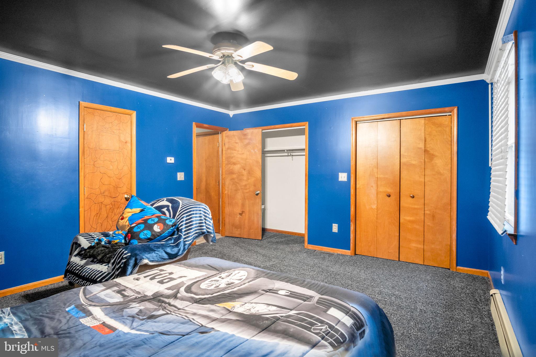16 Hill Road Carlisle, PA 17015 - Photo 18 of 36 a bedroom with a bed and wooden floor