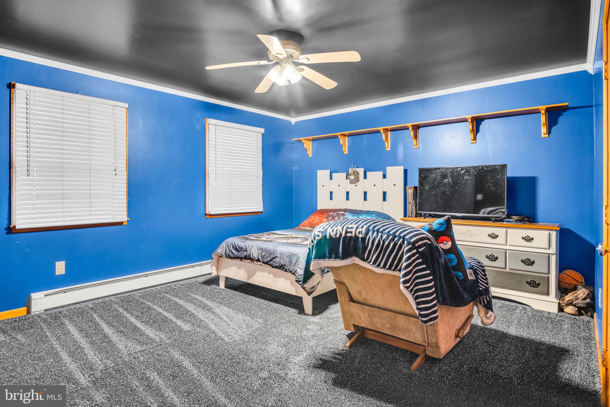 16 Hill Road Carlisle, PA 17015 - Photo 19 of 36 a bedroom with a bed and a chandelier