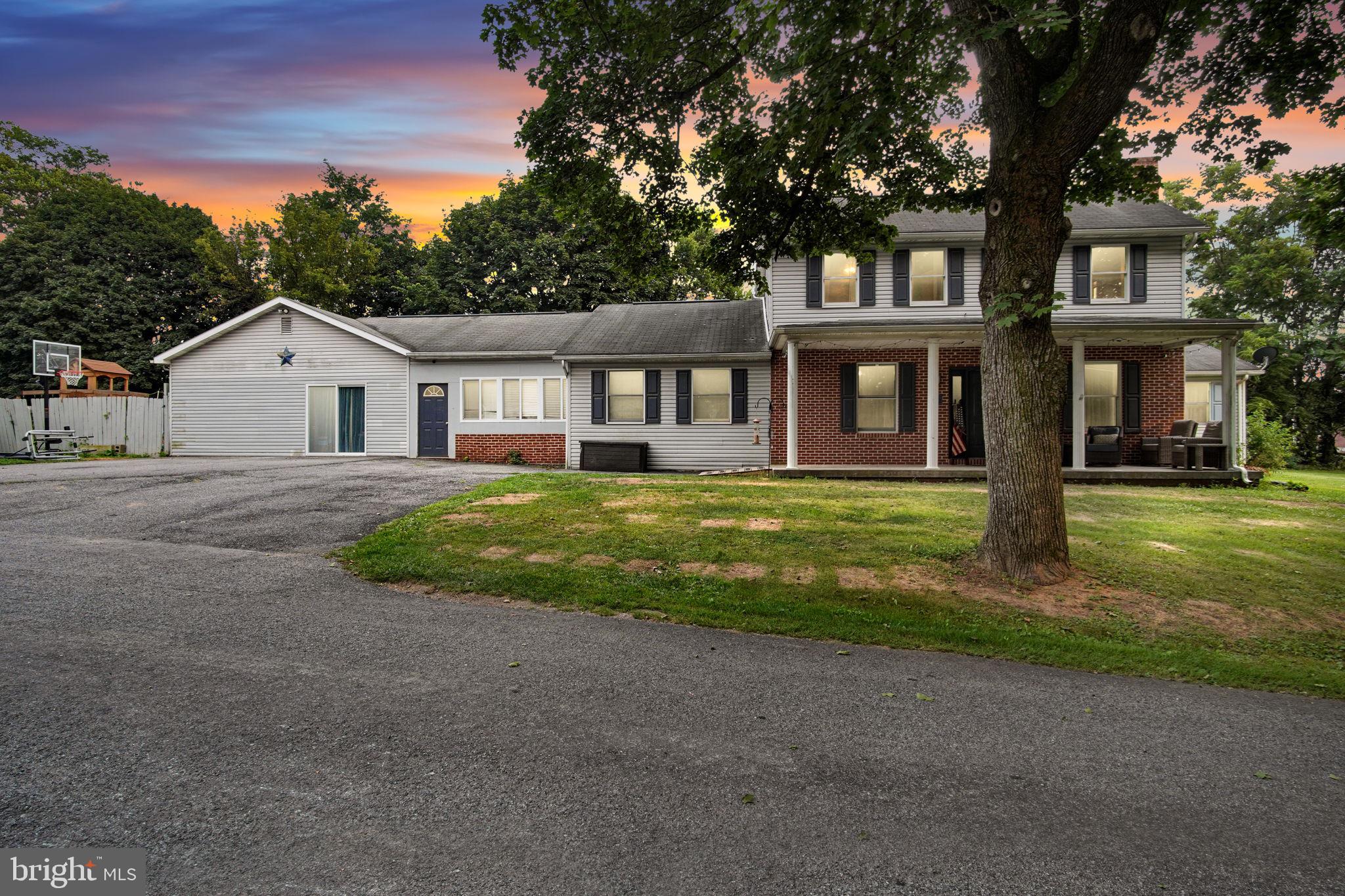 16 Hill Road Carlisle, PA 17015 - Photo 2 of 36 a front view of a house with garden