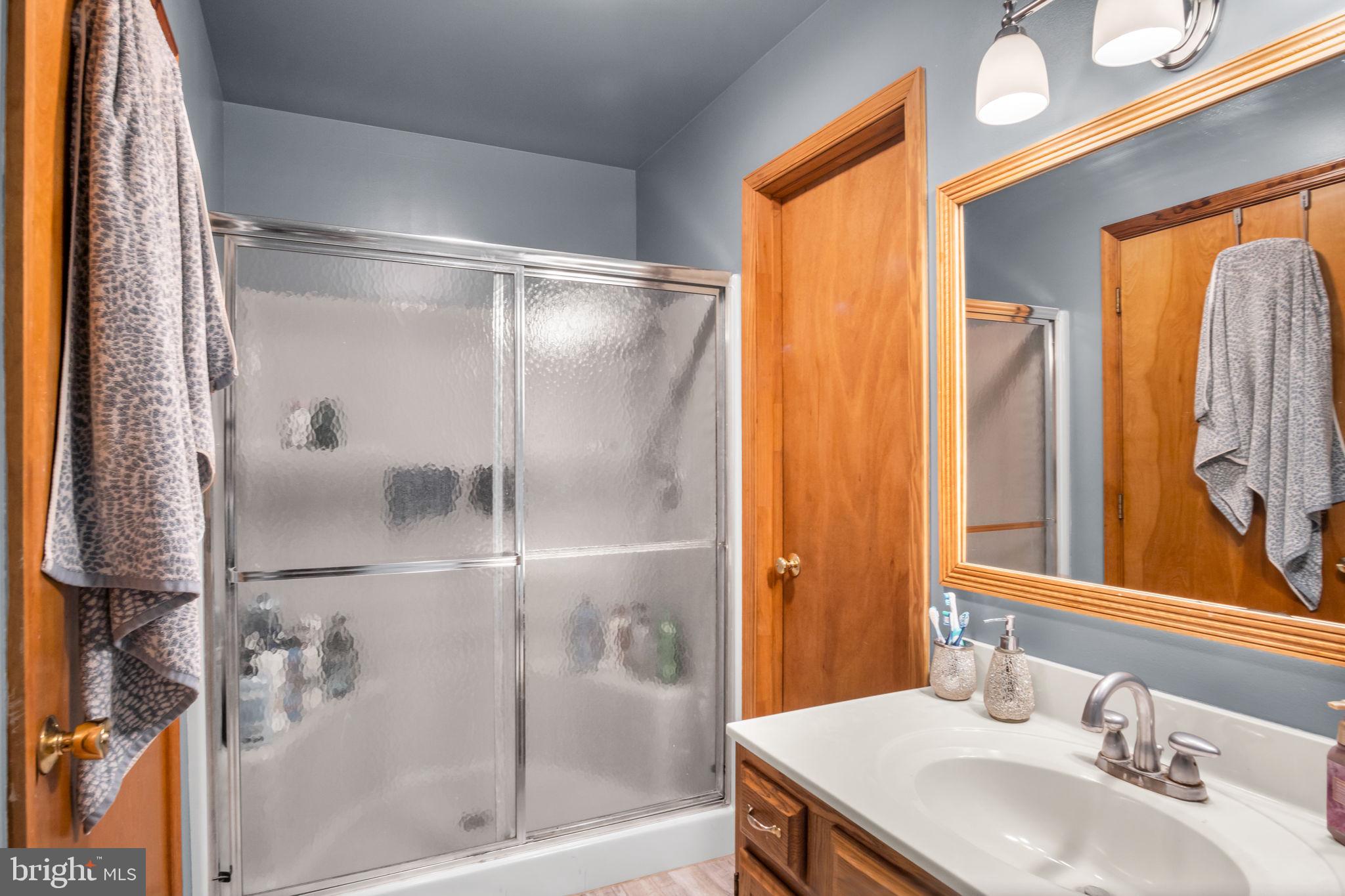 16 Hill Road Carlisle, PA 17015 - Photo 21 of 36 a bathroom with a granite countertop sink and a mirror