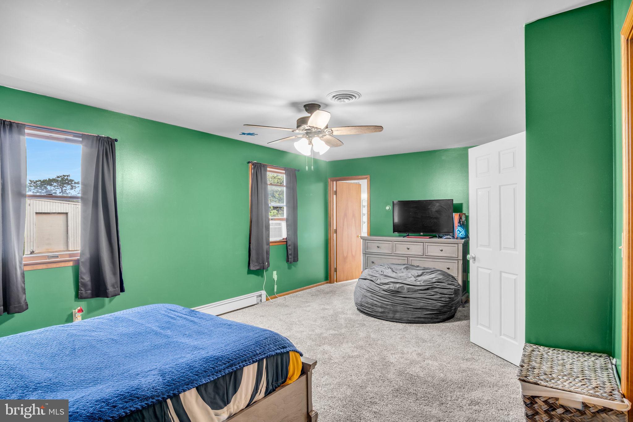 16 Hill Road Carlisle, PA 17015 - Photo 22 of 36 a living room with furniture and a flat screen tv