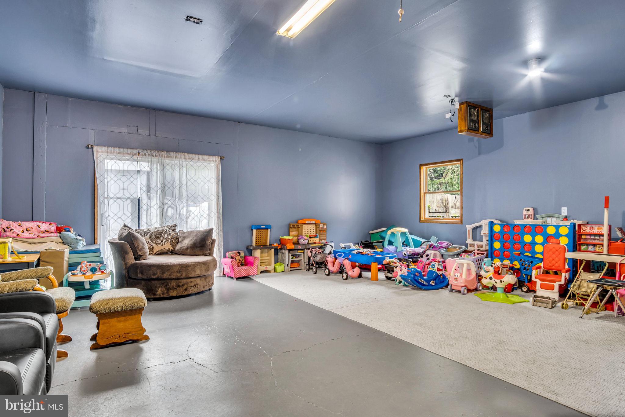 16 Hill Road Carlisle, PA 17015 - Photo 28 of 36 a living room with lots of baby toys and a couch