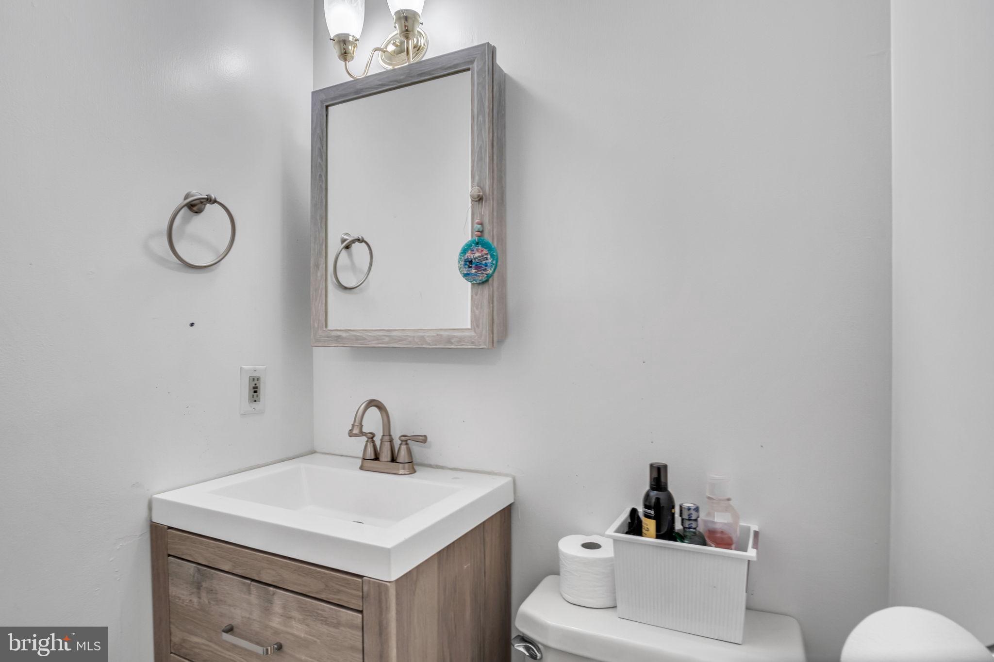 16 Hill Road Carlisle, PA 17015 - Photo 30 of 36 a bathroom with a toilet sink vanity and mirror