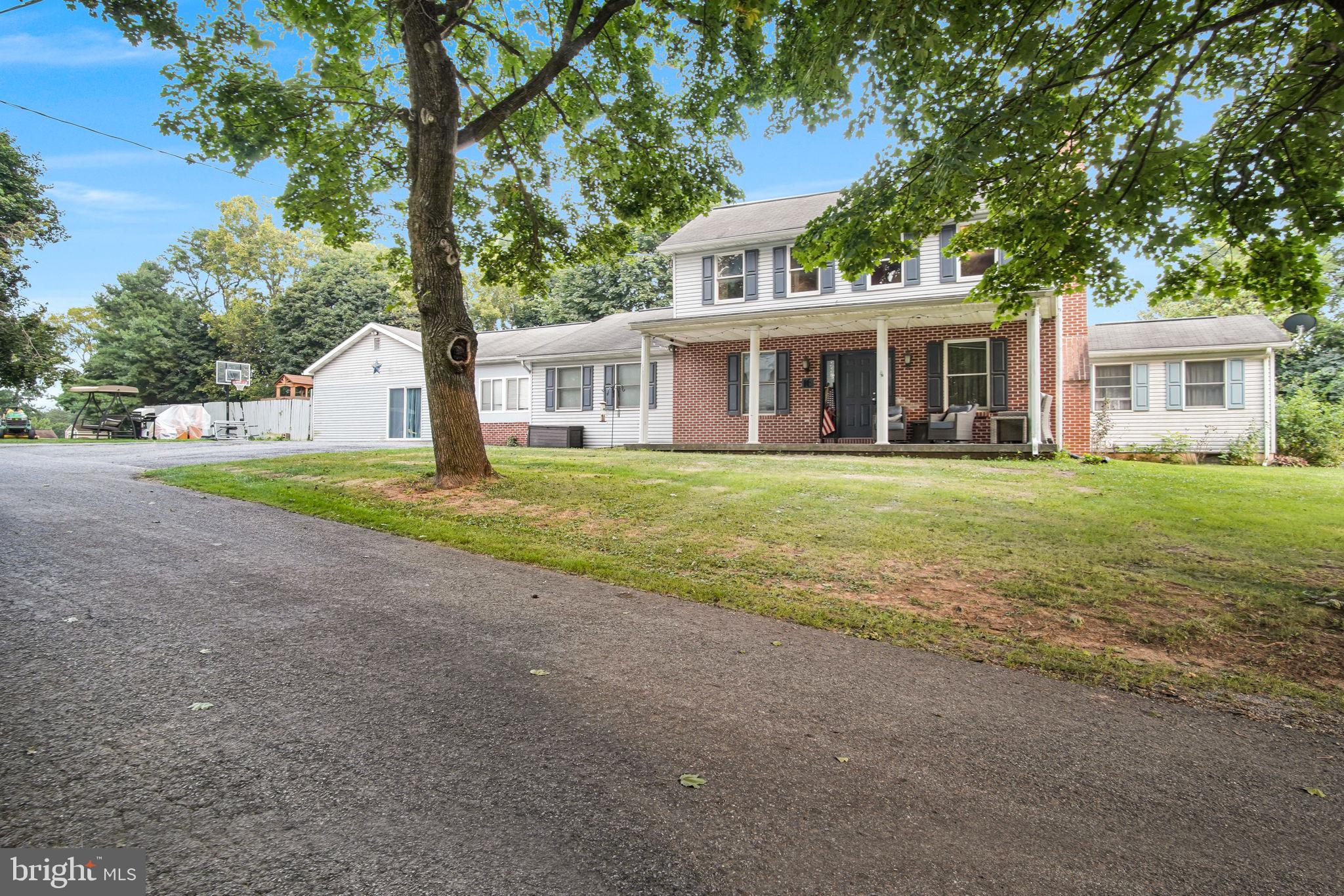 16 Hill Road Carlisle, PA 17015 - Photo 3 of 36 a view of a house with a yard and large trees