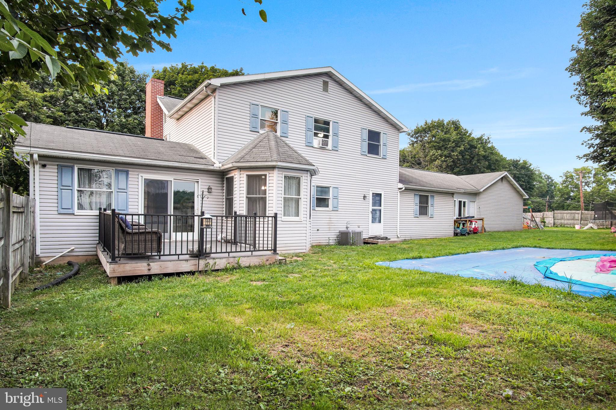 16 Hill Road Carlisle, PA 17015 - Photo 5 of 36 a view of a house with a yard and sitting area