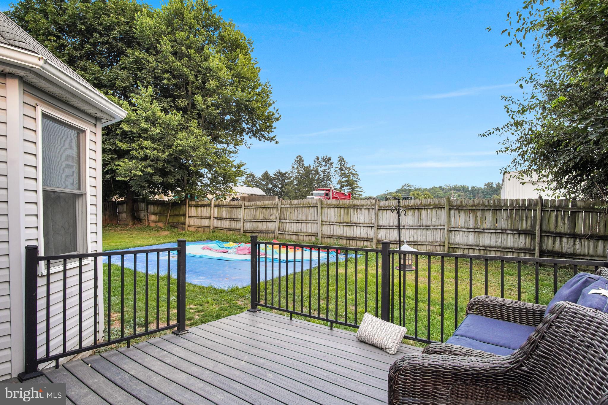 16 Hill Road Carlisle, PA 17015 - Photo 6 of 36 a view of a roof deck with wooden floor and fence