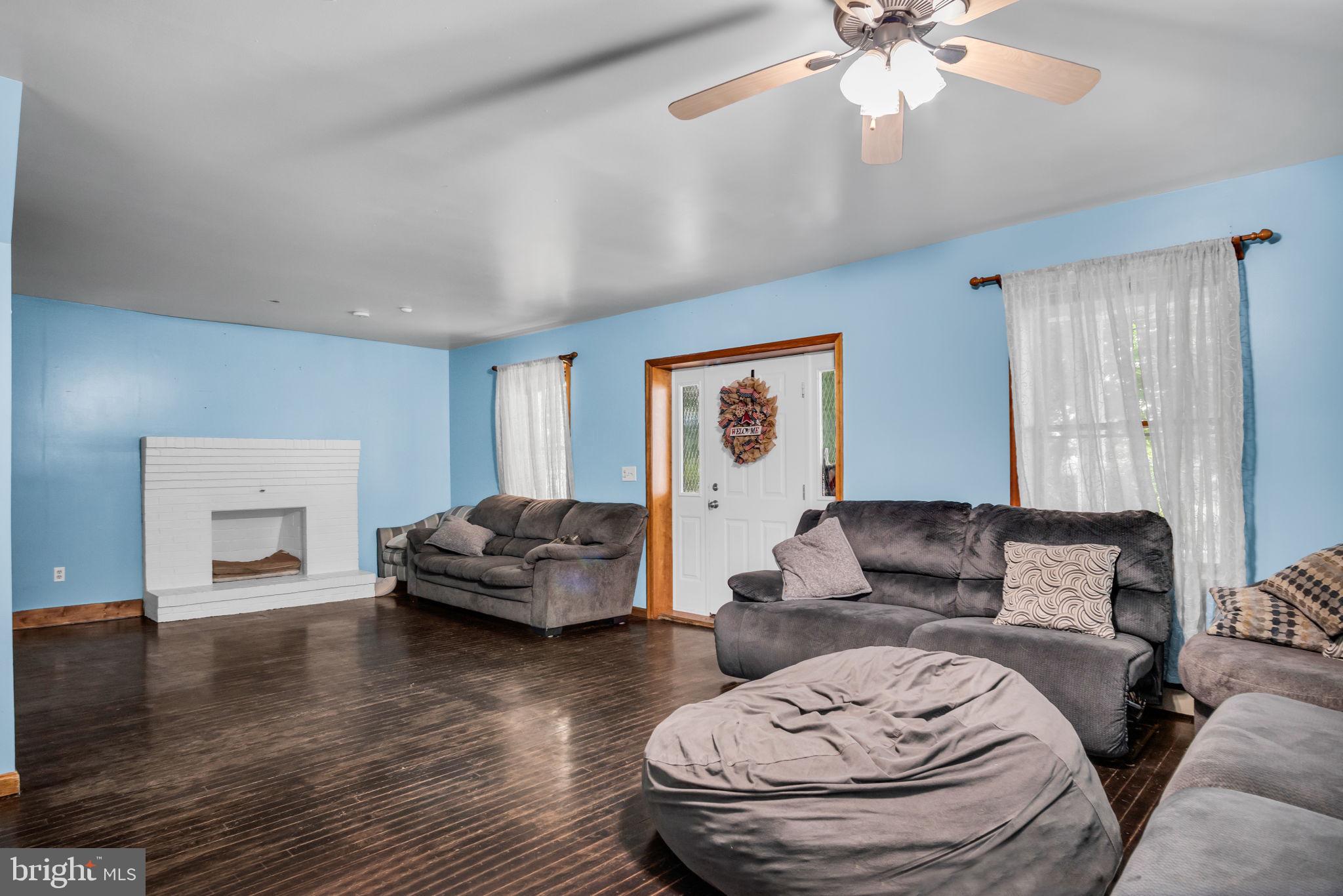 16 Hill Road Carlisle, PA 17015 - Photo 9 of 36 a living room with furniture and a wooden floor