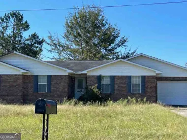 a backyard of a house with lots of green space