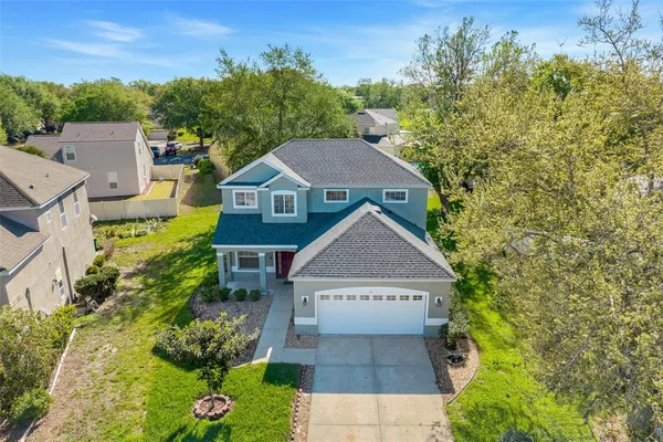 an aerial view of a house having yard