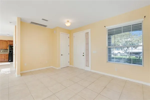 a view of a livingroom with wooden floor and stairs