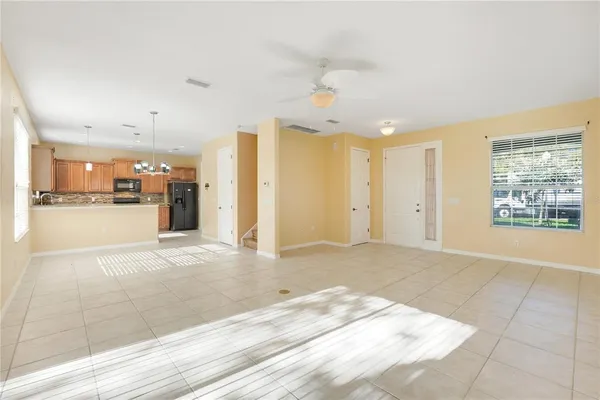 a kitchen with stainless steel appliances granite countertop a sink a stove and a refrigerator