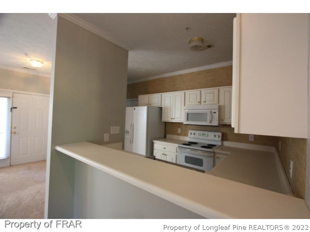 522-6 Lionshead Road Fayetteville, NC 28311 - Photo 13 of 19 a kitchen with stainless steel appliances a refrigerator and a stove