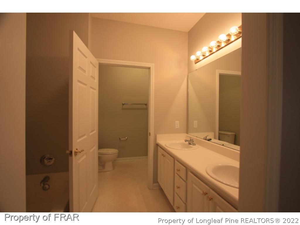 522-6 Lionshead Road Fayetteville, NC 28311 - Photo 5 of 19 a bathroom with a sink and a mirror