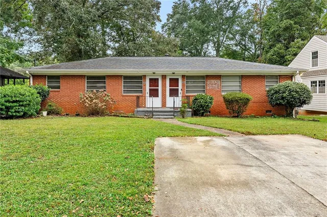 front view of a house with a yard