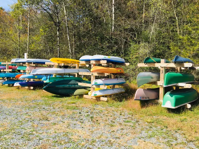 a view of swimming pool with outdoor seating